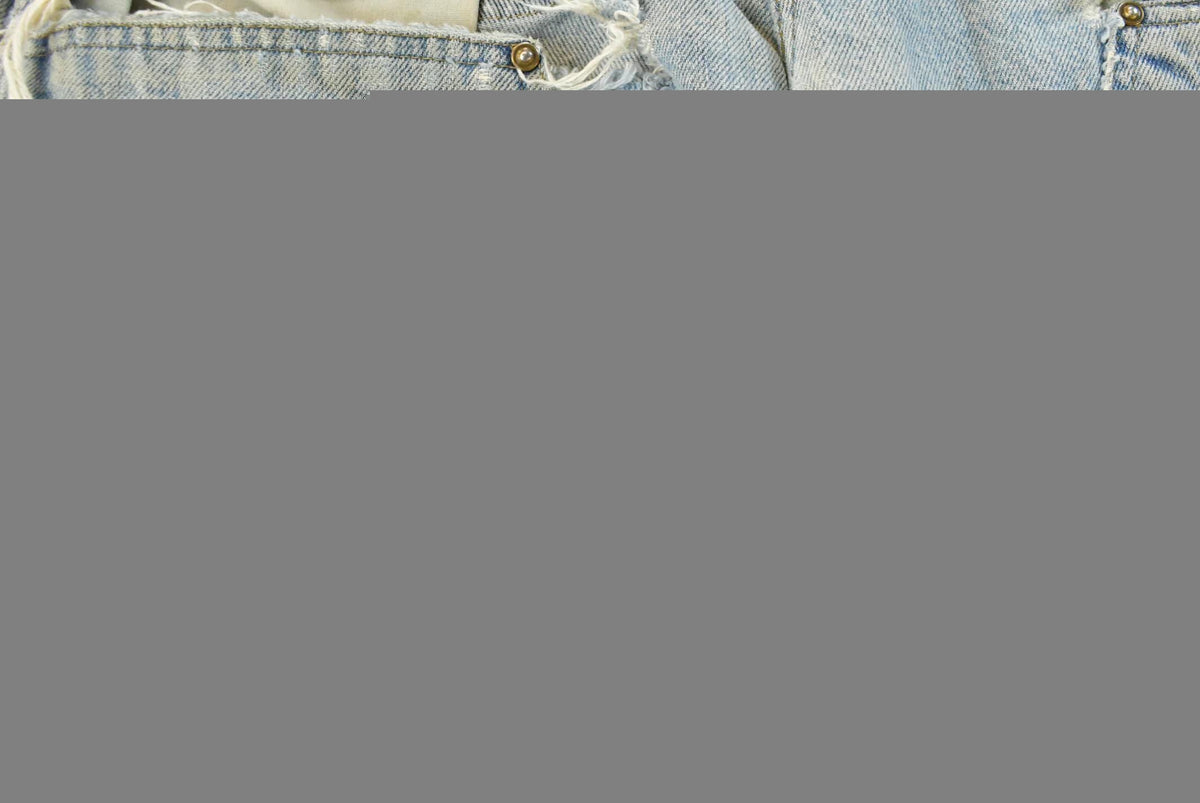 Vintage 1990s Carhartt Distressed Double Knee Denim Work Jeans Men's 31 x 33 from propervintagecanada
