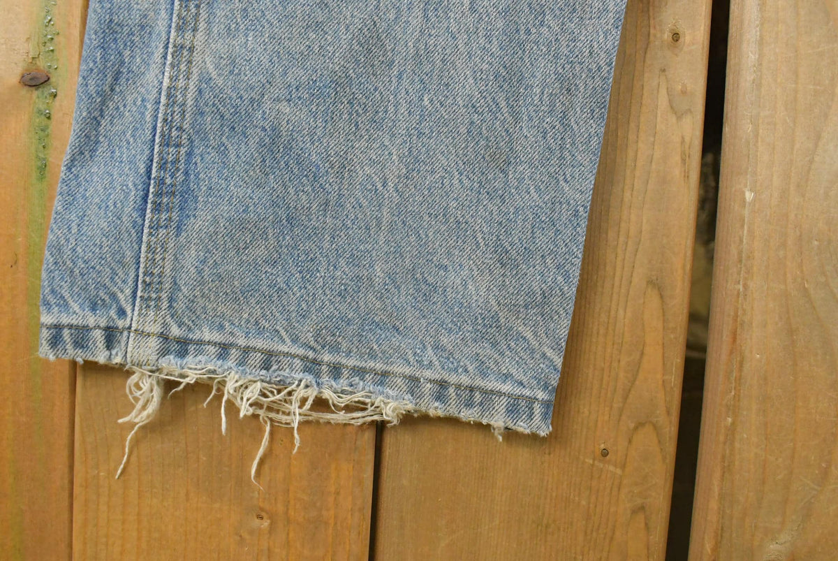 Vintage 1990s Carhartt Distressed Double Knee Denim Work Jeans Men's 31 x 33 from propervintagecanada