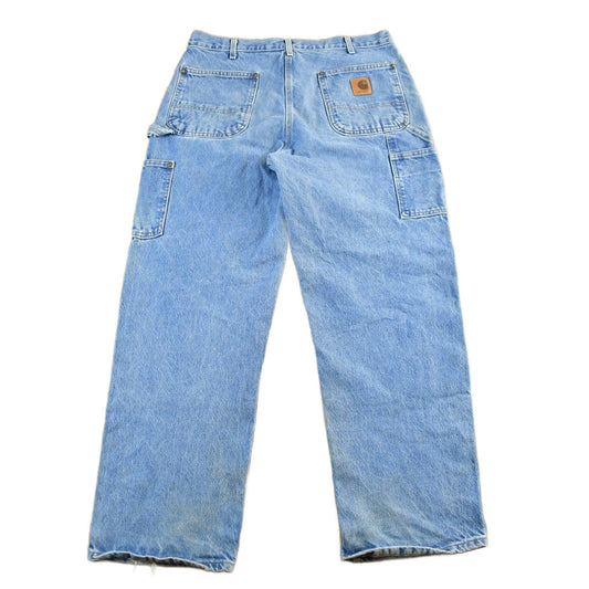 Vintage 1990s Carhartt Distressed Double Knee Denim Work Jeans Men's 34 x 30 from propervintagecanada