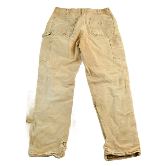 Vintage 1990s Carhartt Distressed Double Knee Denim Work Jeans Men's 34 x 32 from propervintagecanada