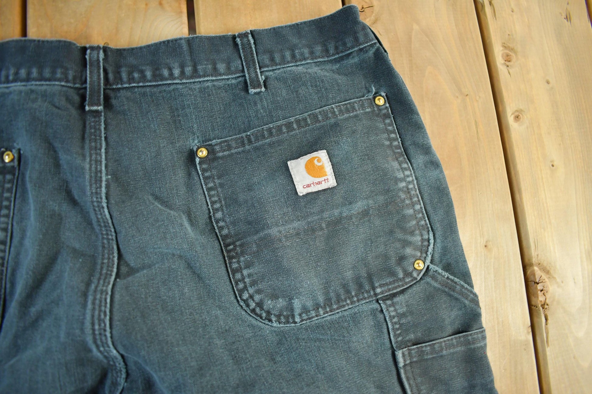 Vintage 1990s Carhartt Distressed Double Knee Denim Work Jeans Men's Large 36 x 30 from propervintagecanada