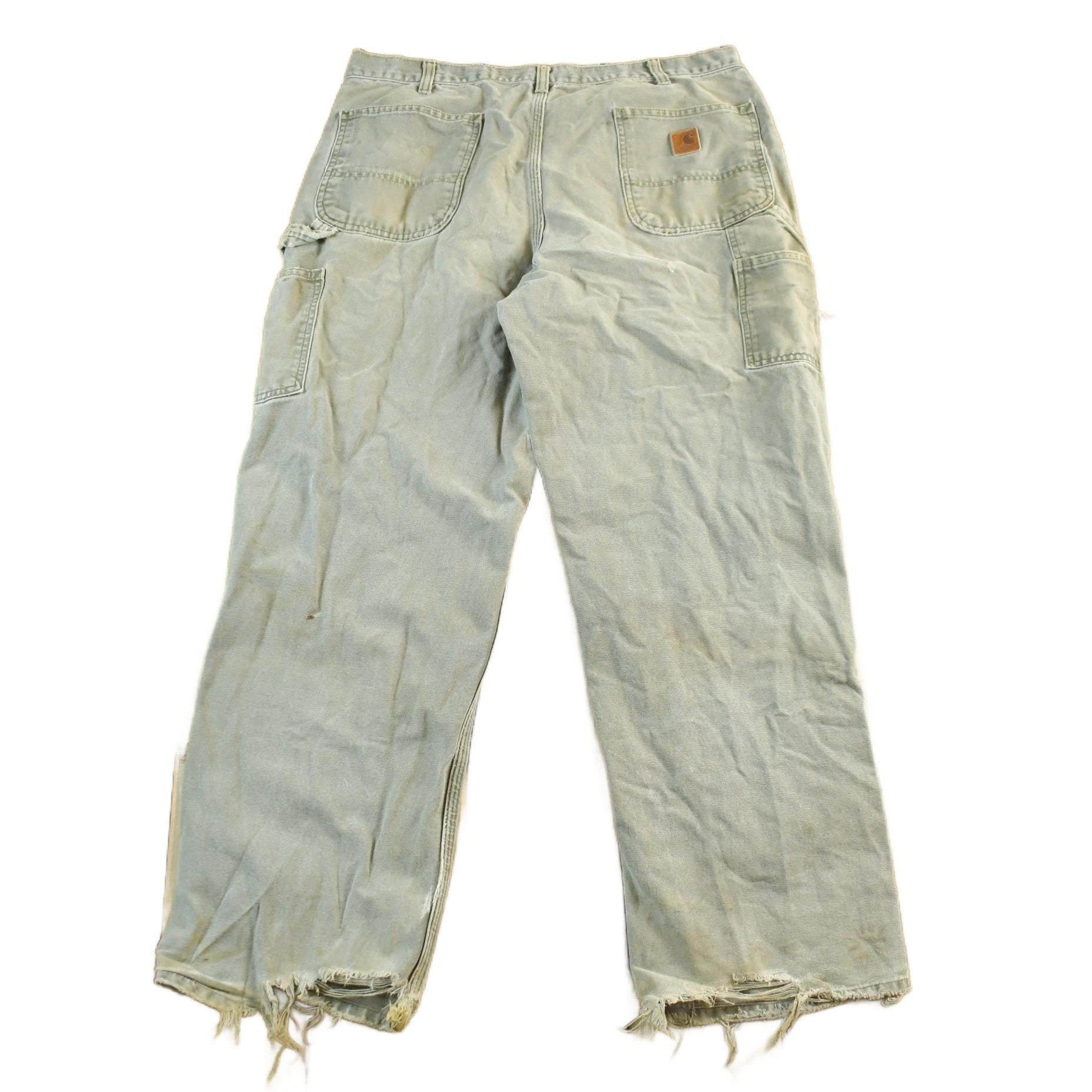 Vintage 1990s Carhartt Distressed Sun Faded Denim Work Jeans Men's 37 x 30 from propervintagecanada