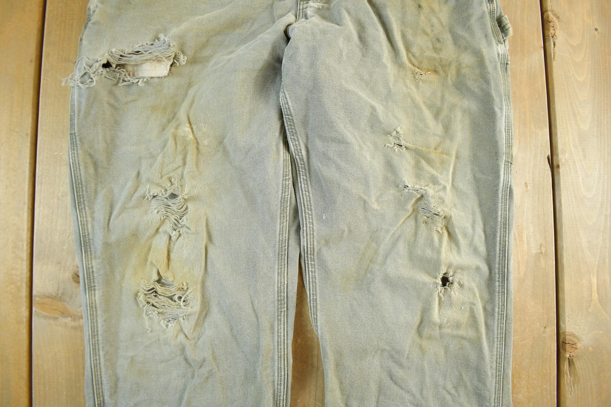 Vintage 1990s Carhartt Distressed Sun Faded Denim Work Jeans Men's 37 x 30 from propervintagecanada