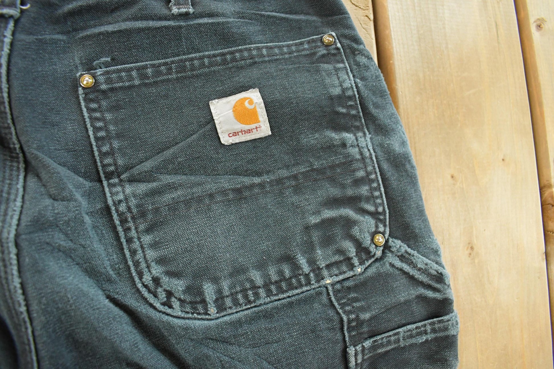 Vintage 1990s Carhartt Distressed Sun Faded Double Knee Pants Men's 31 x 32 from propervintagecanada