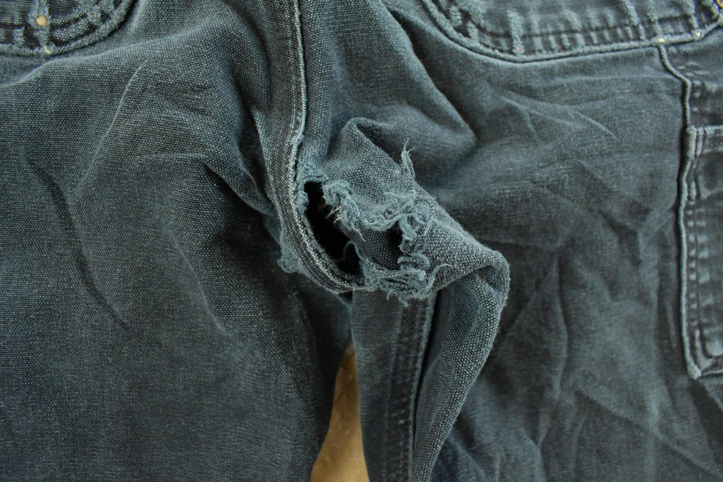 Vintage 1990s Carhartt Distressed Sun Faded Double Knee Pants Men's 31 x 32 from propervintagecanada