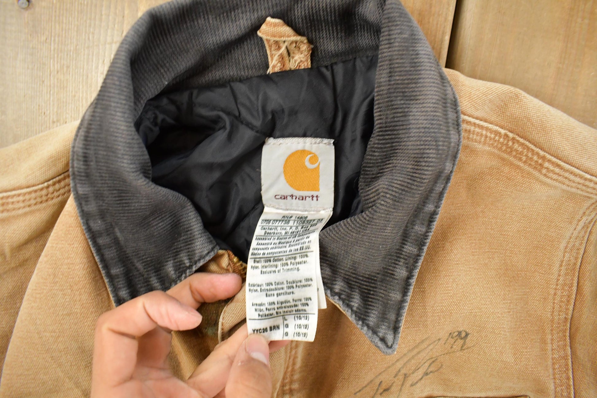 Vintage 1990s Carhartt Distressed Work Jacket Youth Large from propervintagecanada