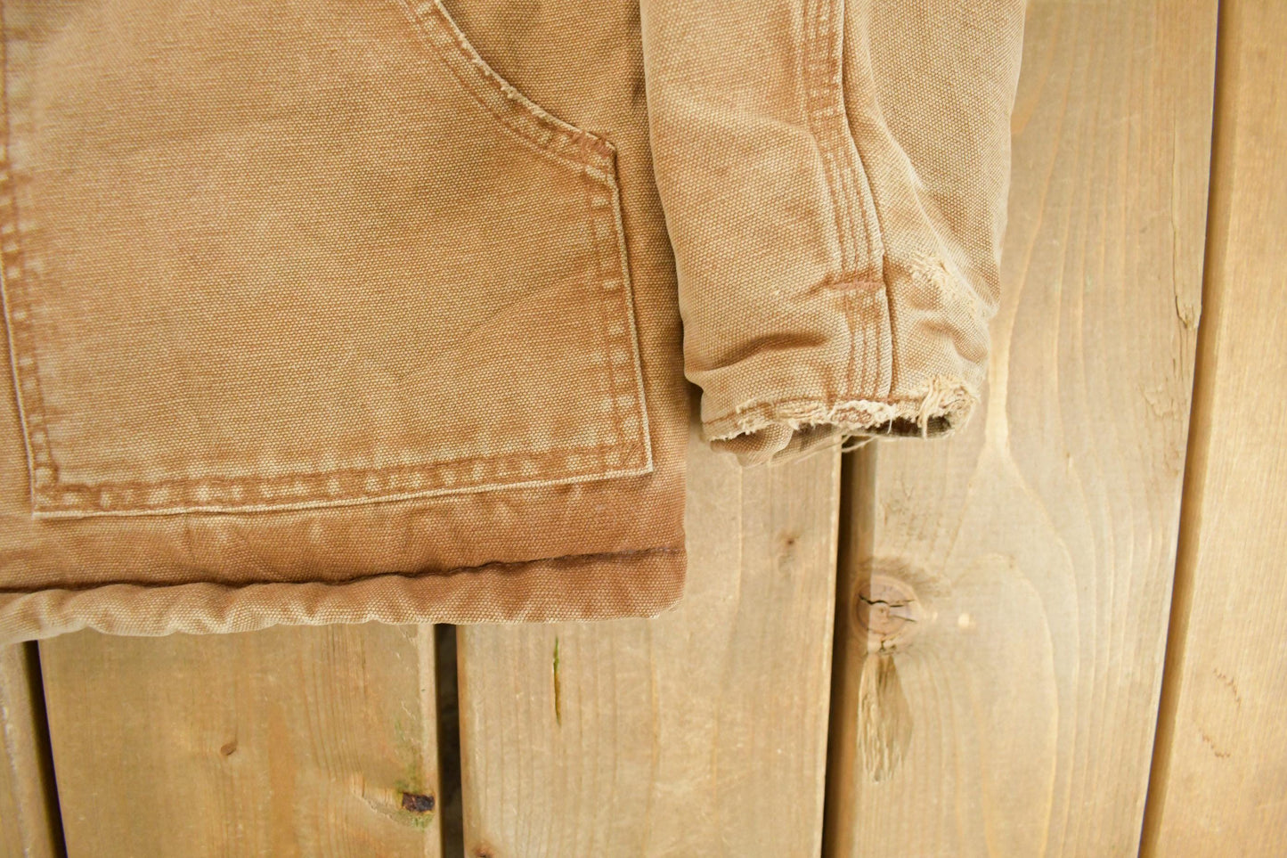 Vintage 1990s Carhartt Distressed Work Jacket Youth Large from propervintagecanada
