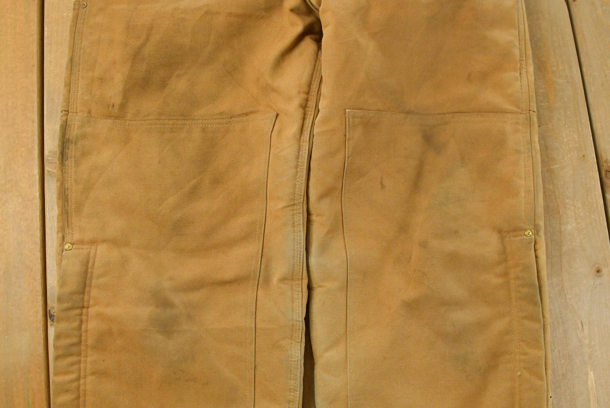 Vintage 1990s Carhartt Double Knee Insulated Canvas Bib Overalls Men's 39 x 32 from propervintagecanada