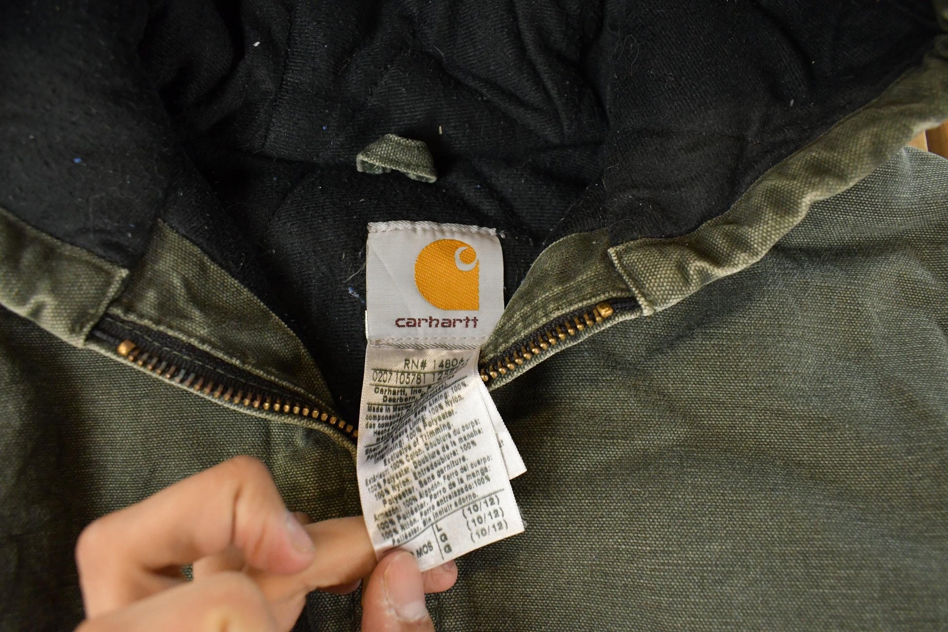 Vintage 1990s Carhartt Hooded Distressed Work Jacket Youth Large from propervintagecanada