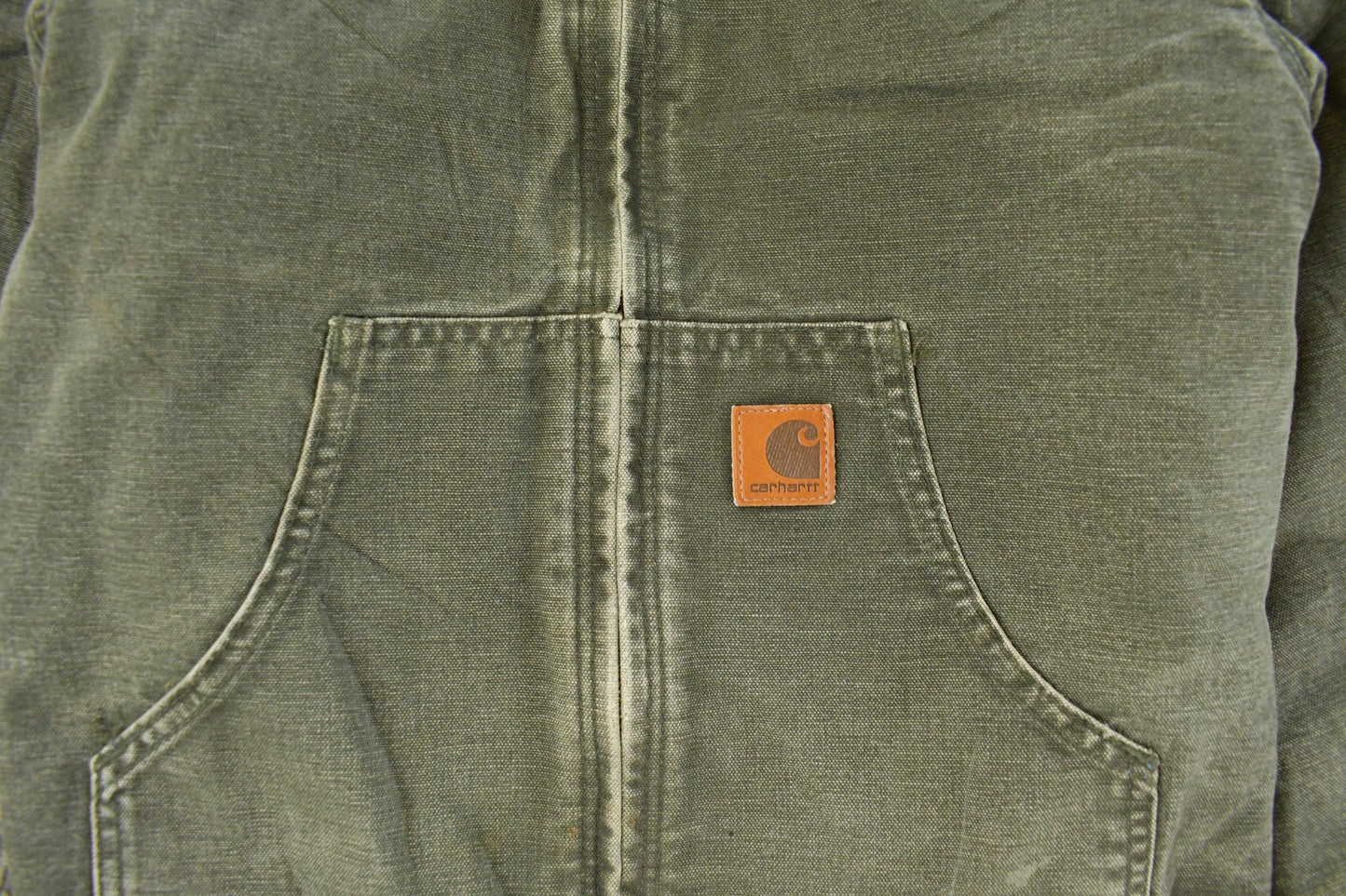Vintage 1990s Carhartt Hooded Distressed Work Jacket Youth Large from propervintagecanada