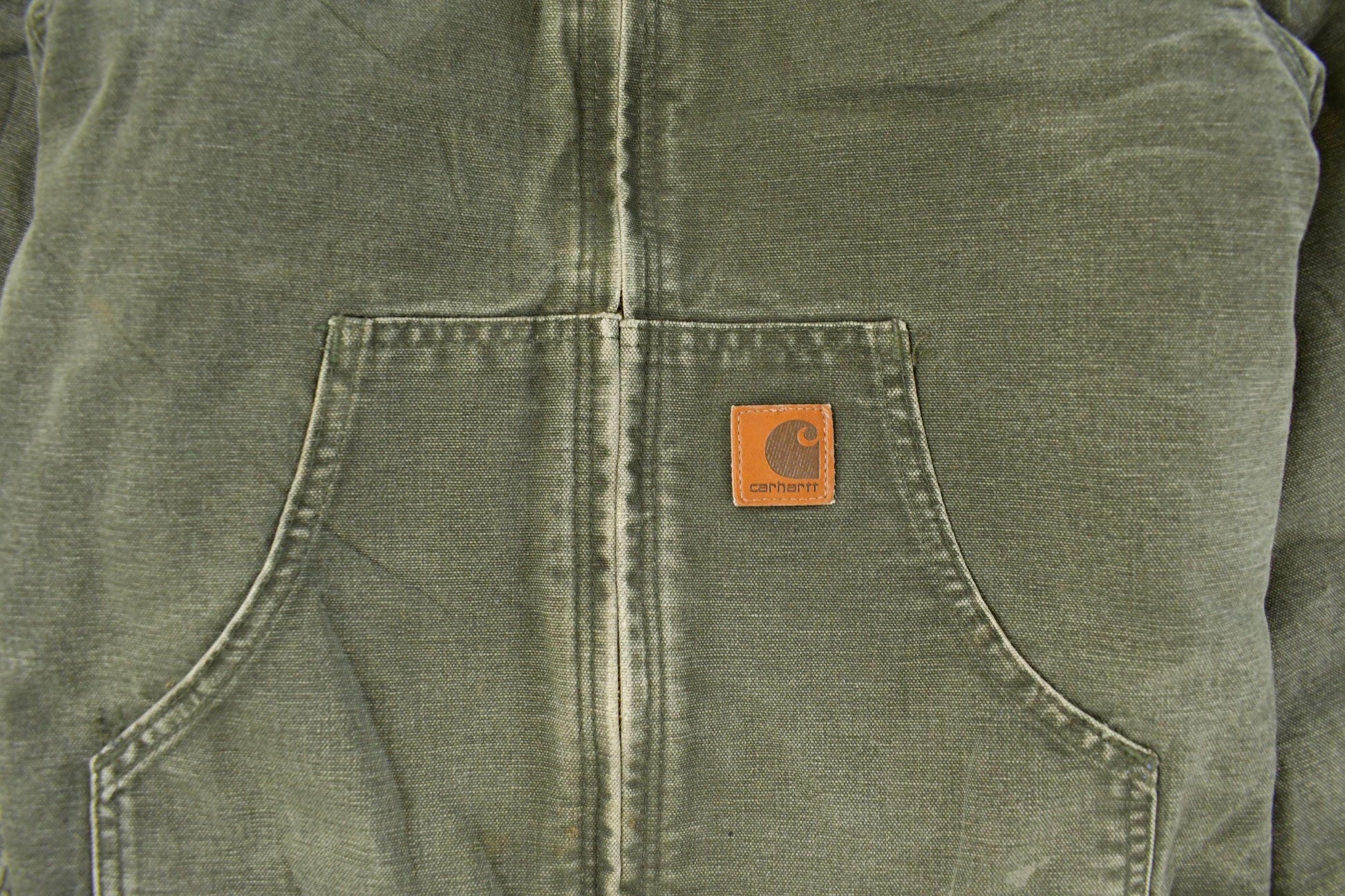 Vintage 1990s Carhartt Hooded Distressed Work Jacket Youth Large from propervintagecanada
