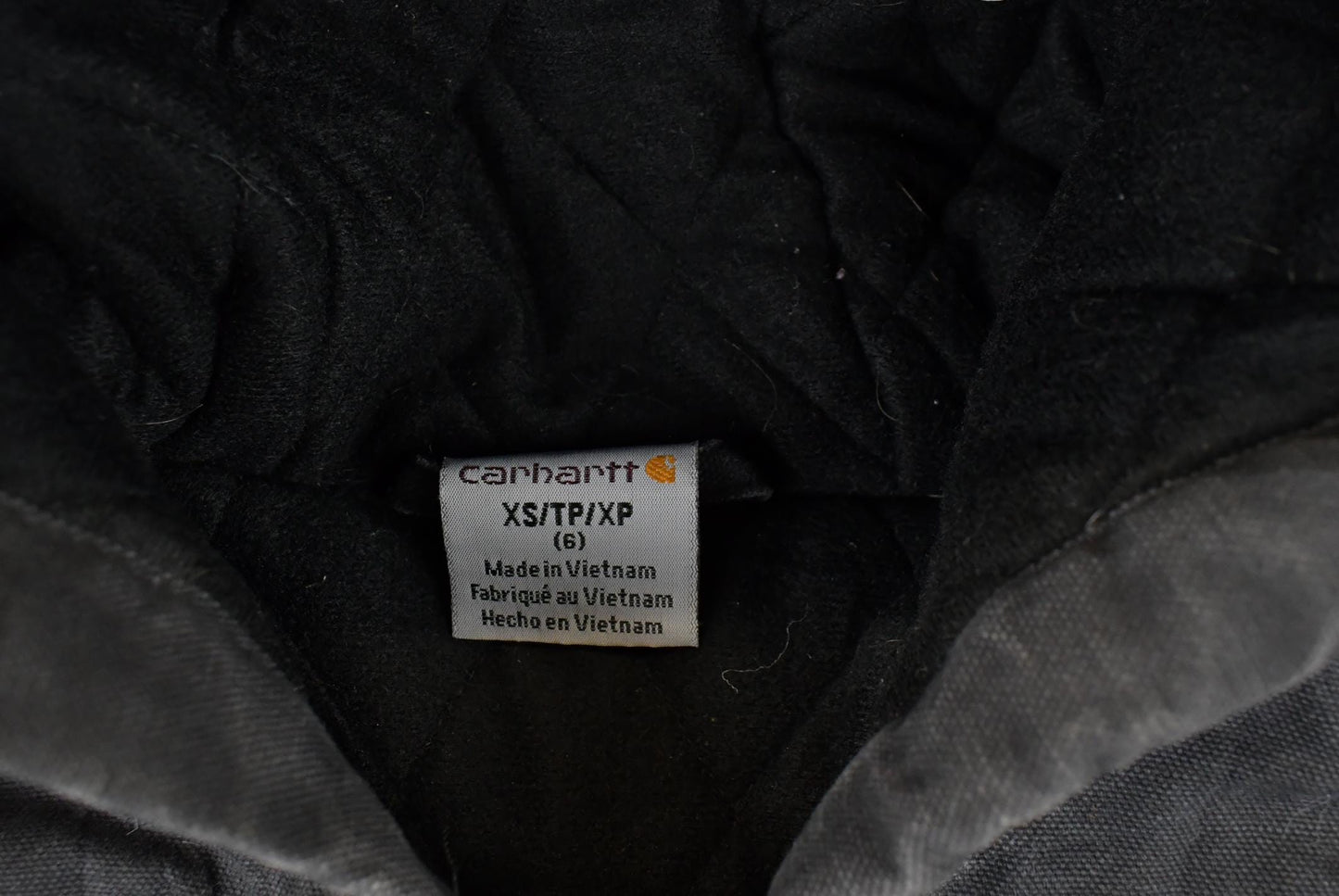 Vintage 1990s Carhartt Hooded Distressed Work Jacket Youth XS from propervintagecanada