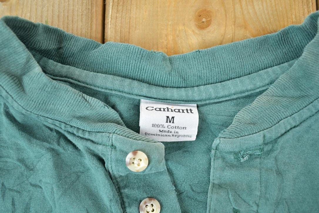 Vintage 1990s Carhartt Long Sleeve Workwear Souvenir Single Stitch T-Shirt Made In USA Men's Medium from propervintagecanada