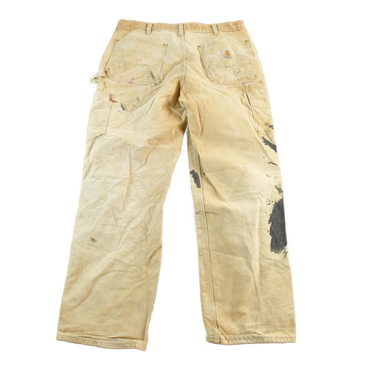Vintage 1990s Carhartt Paint Distressed Double Knee Denim Work Jeans Men's Medium 34 x 29 from propervintagecanada