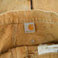 Vintage 1990s Carhartt Paint Distressed Double Knee Denim Work Jeans Men's Medium 34 x 29 from propervintagecanada