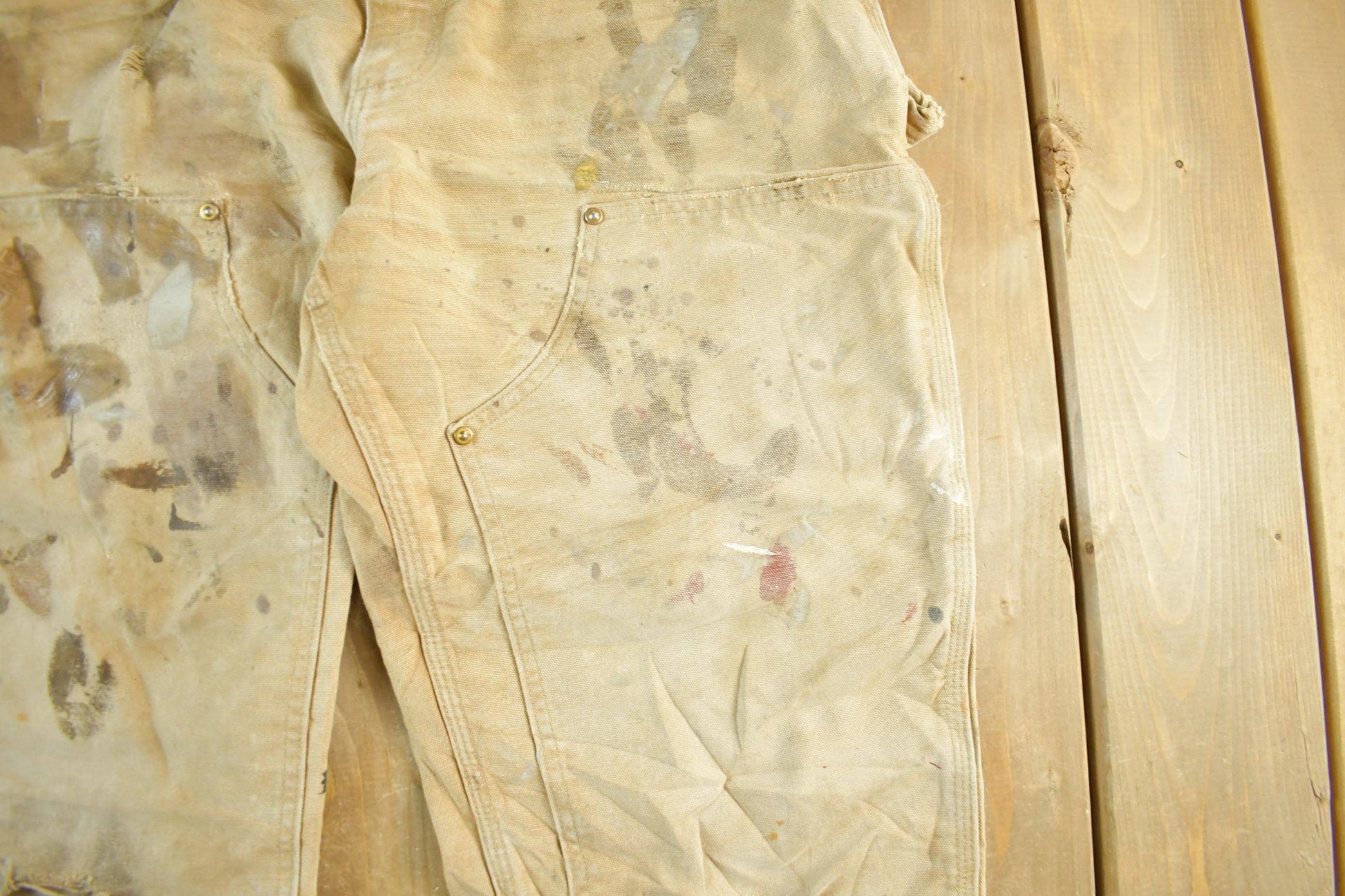 Vintage 1990s Carhartt Paint Distressed Double Knee Denim Work Jeans Men's Medium 34 x 29 from propervintagecanada