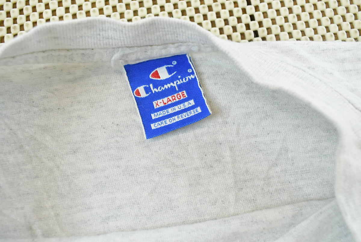 Vintage 1990s Champion Big Logo Spellout Graphic T-Shirt Men's L from propervintagecanada