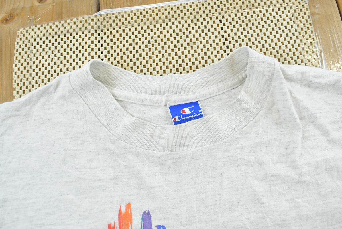Vintage 1990s Champion Big Logo Spellout Graphic T-Shirt Men's L from propervintagecanada