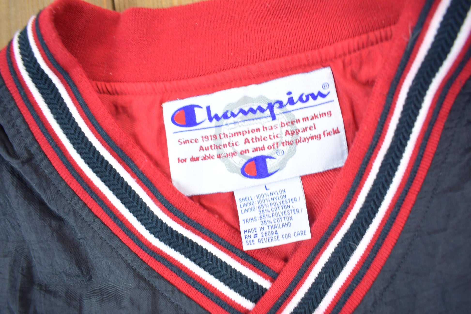 Vintage 1990s Champion Embroidered Spell Out Windbreaker Men's Large from propervintagecanada