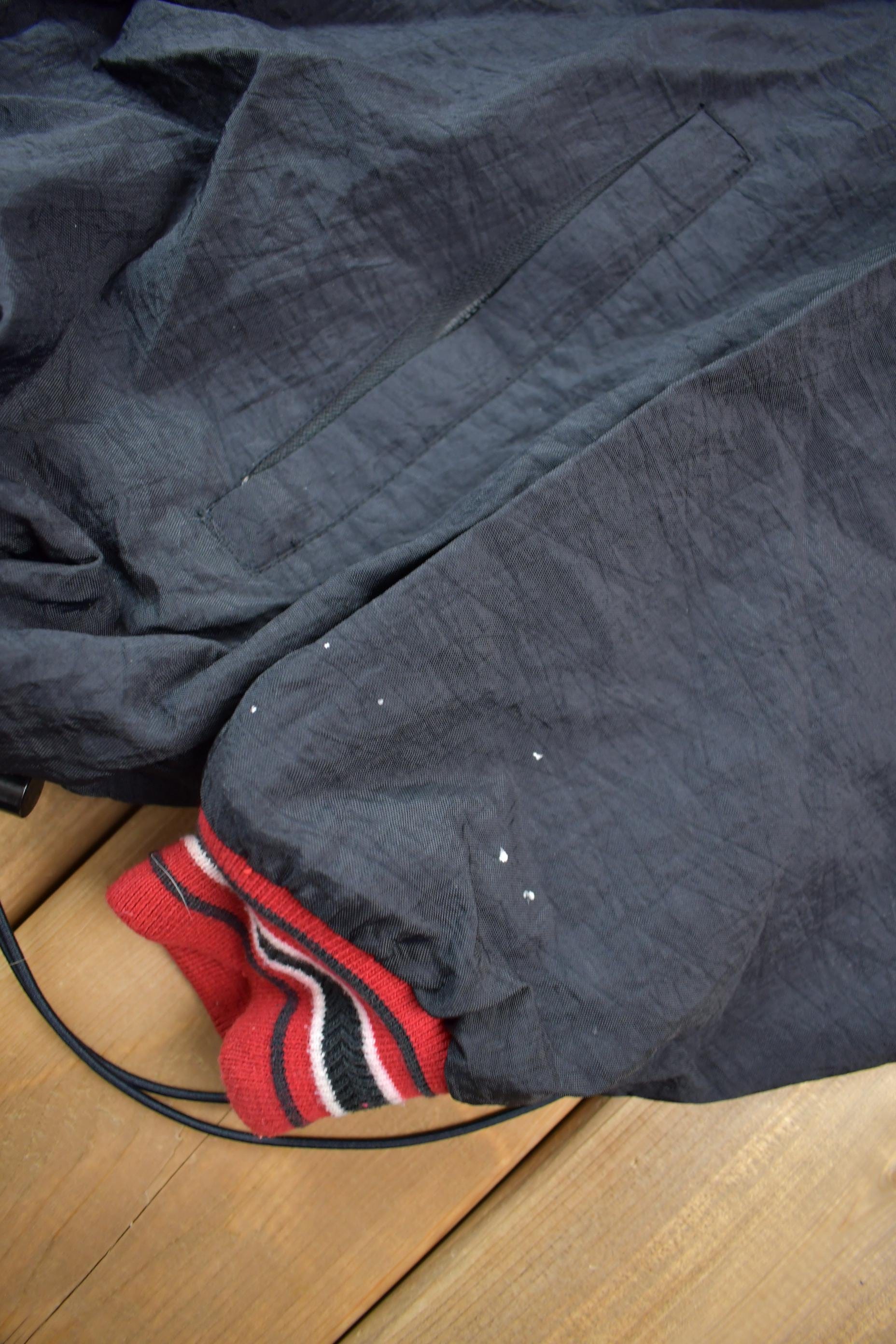 Vintage 1990s Champion Embroidered Spell Out Windbreaker Men's Large from propervintagecanada