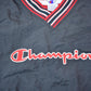 Vintage 1990s Champion Embroidered Spell Out Windbreaker Men's Large from propervintagecanada