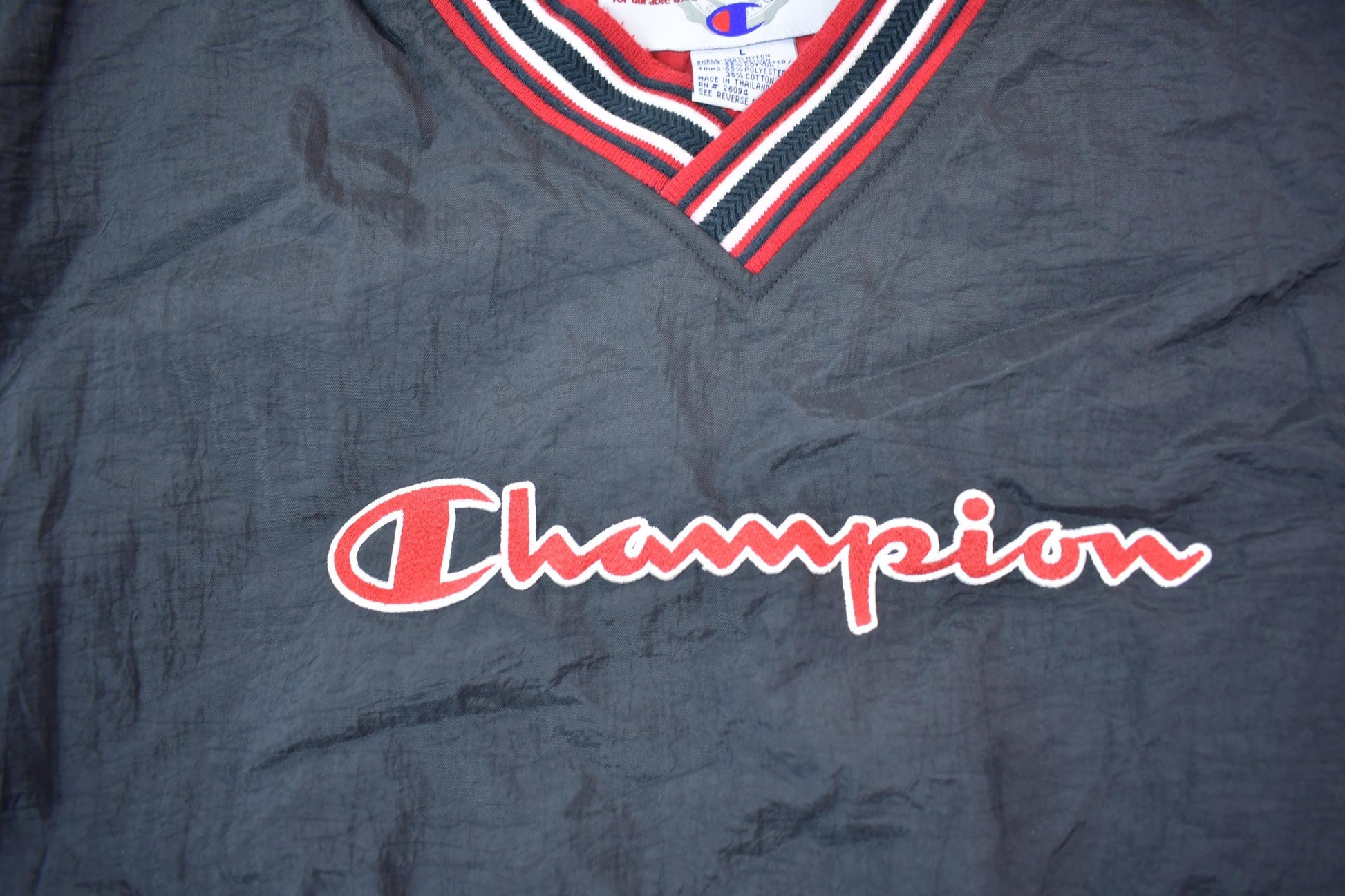 Vintage 1990s Champion Embroidered Spell Out Windbreaker Men's Large from propervintagecanada