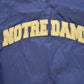 Vintage 1990s Champion Notre Dame Graphic Windbreaker Jacket Men's 2XL from propervintagecanada