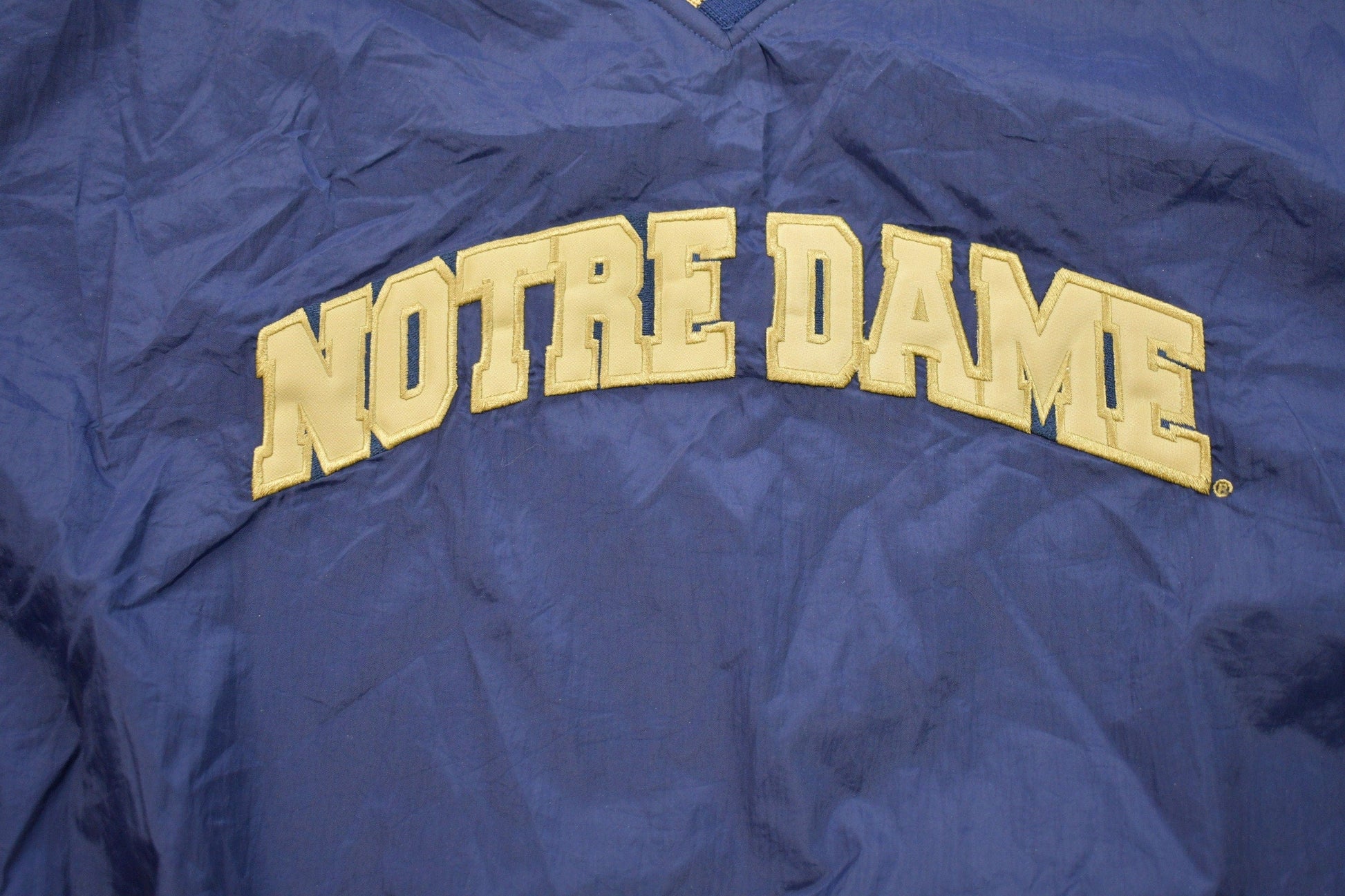 Vintage 1990s Champion Notre Dame Graphic Windbreaker Jacket Men's 2XL from propervintagecanada