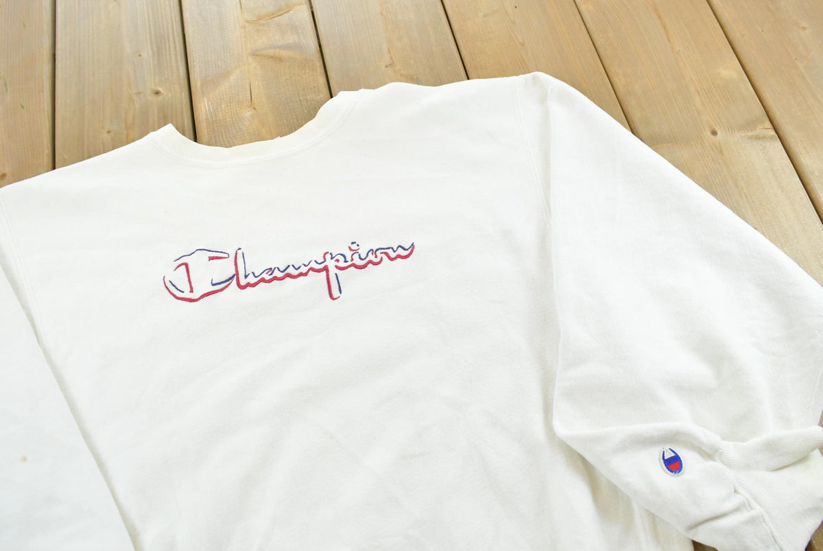 Vintage 1990s Champion Reverse Weave Logo Spellout Crewneck Sweater Men's L from propervintagecanada