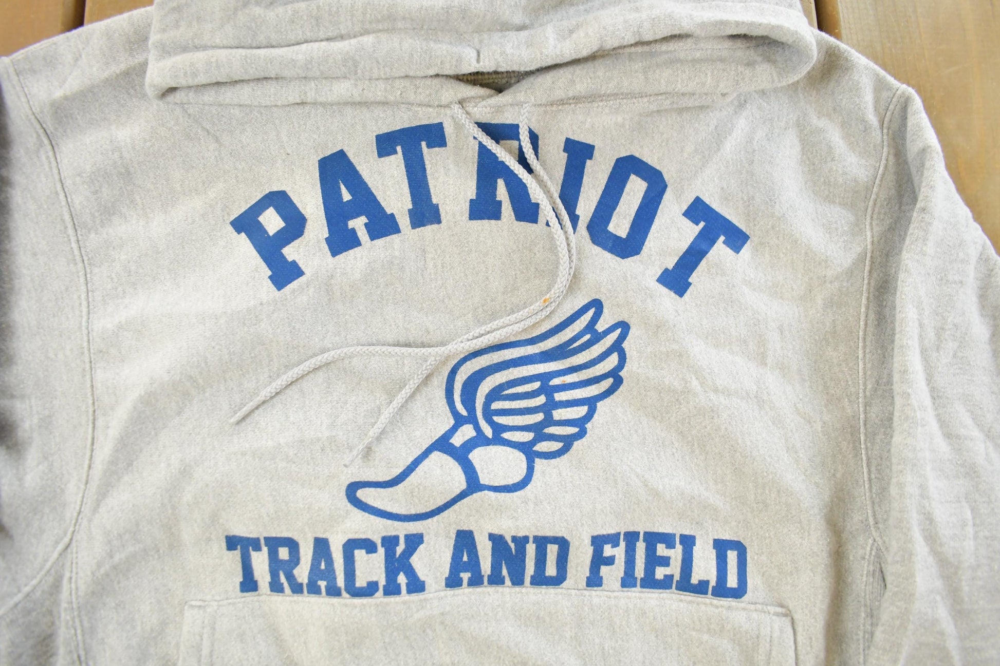 Vintage 1990s Champion Reverse Weave Patriot Track & Field Hoodie Sweatshirt Men's Small from propervintagecanada
