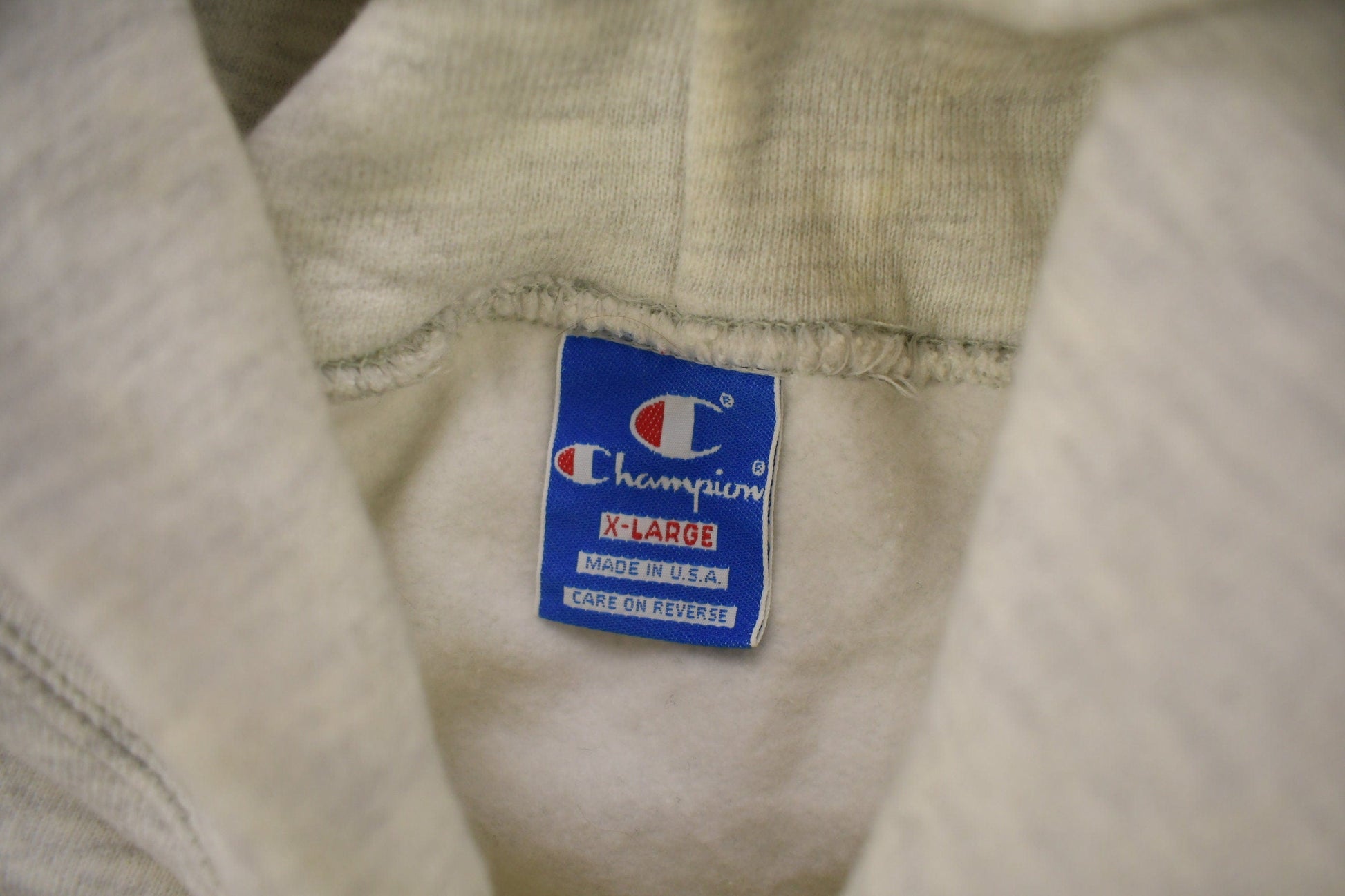 Vintage 1990s Champion Small Logo Grey Hoodie from propervintagecanada