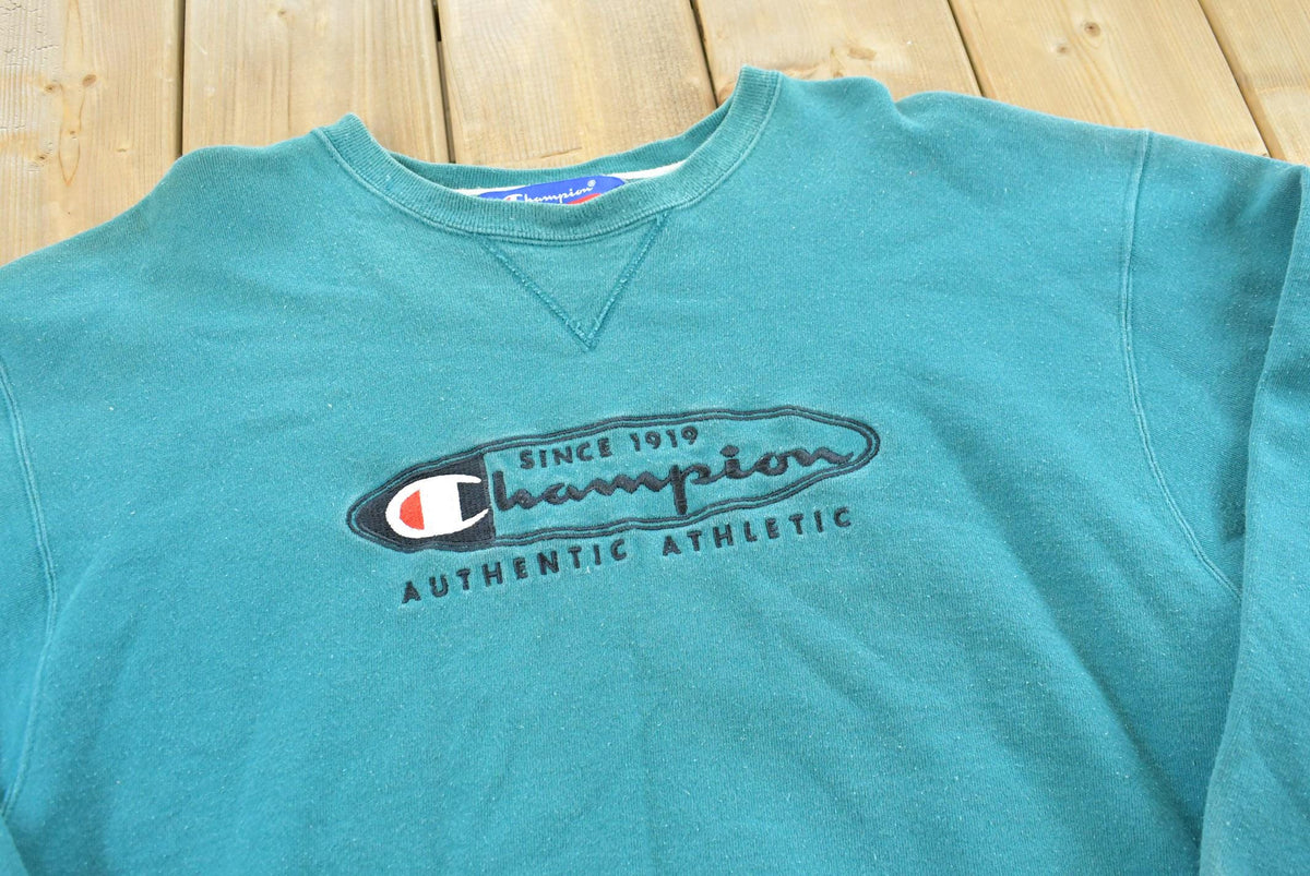 Vintage 1990s Champion Spellout Crewneck Sweatshirt Men's L from propervintagecanada