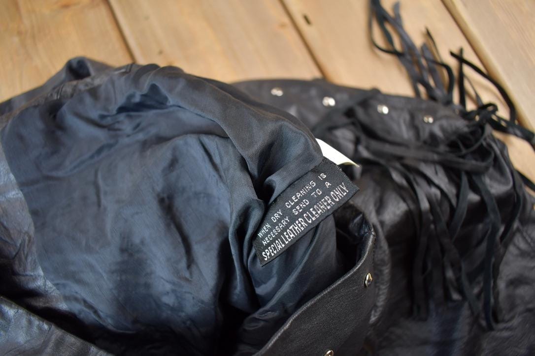 Vintage 1990s Chia Black Fringe Leather Jacket Women's XS from propervintagecanada