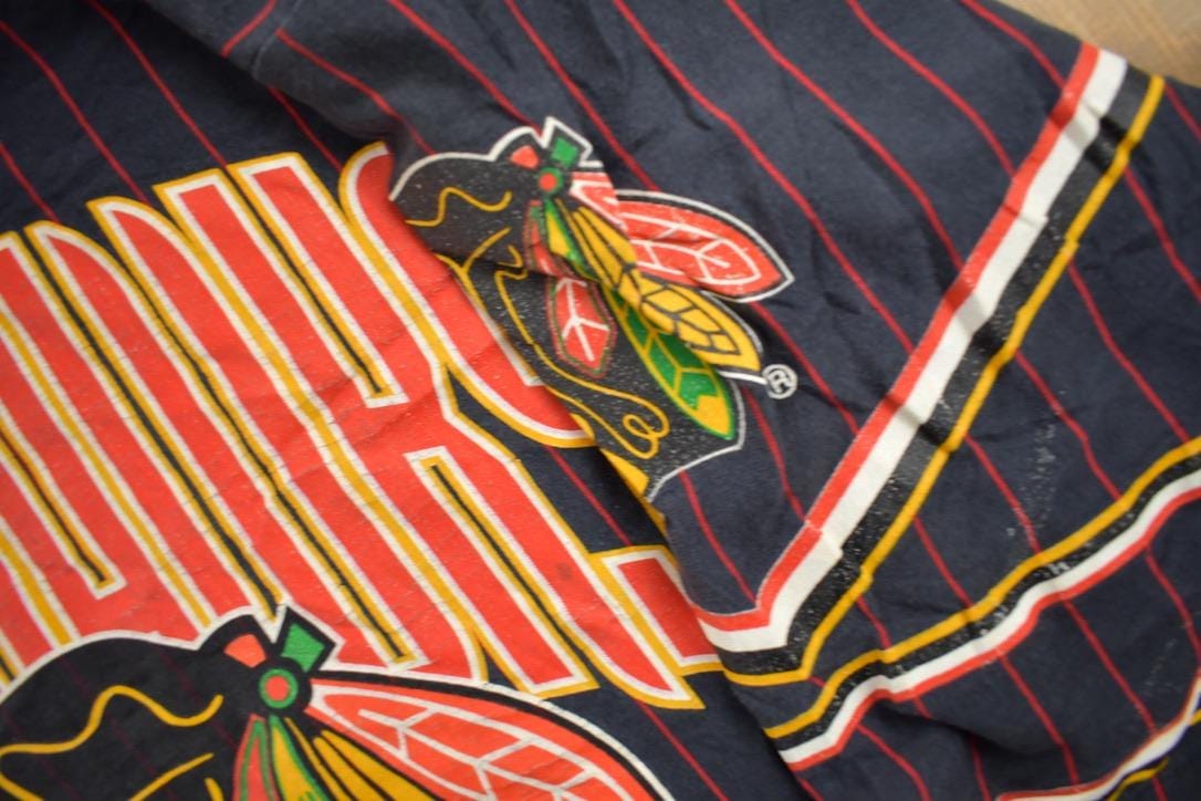 Vintage 1990s Chicago Blackhawks NHL All Over Print Graphic T-Shirt Men's Large from propervintagecanada
