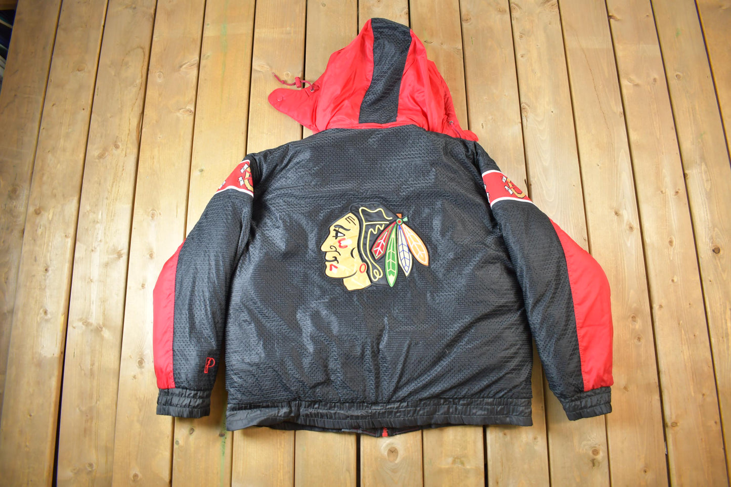 Vintage 1990s Chicago Blackhawks Reversible NHL Hockey Puffer Hooded Jacket from propervintagecanada
