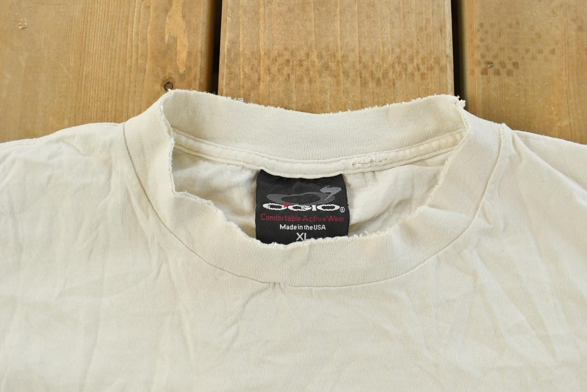 Vintage 1990s Chump Strike Me Out Baseball Graphic T-Shirt Men's XL from propervintagecanada