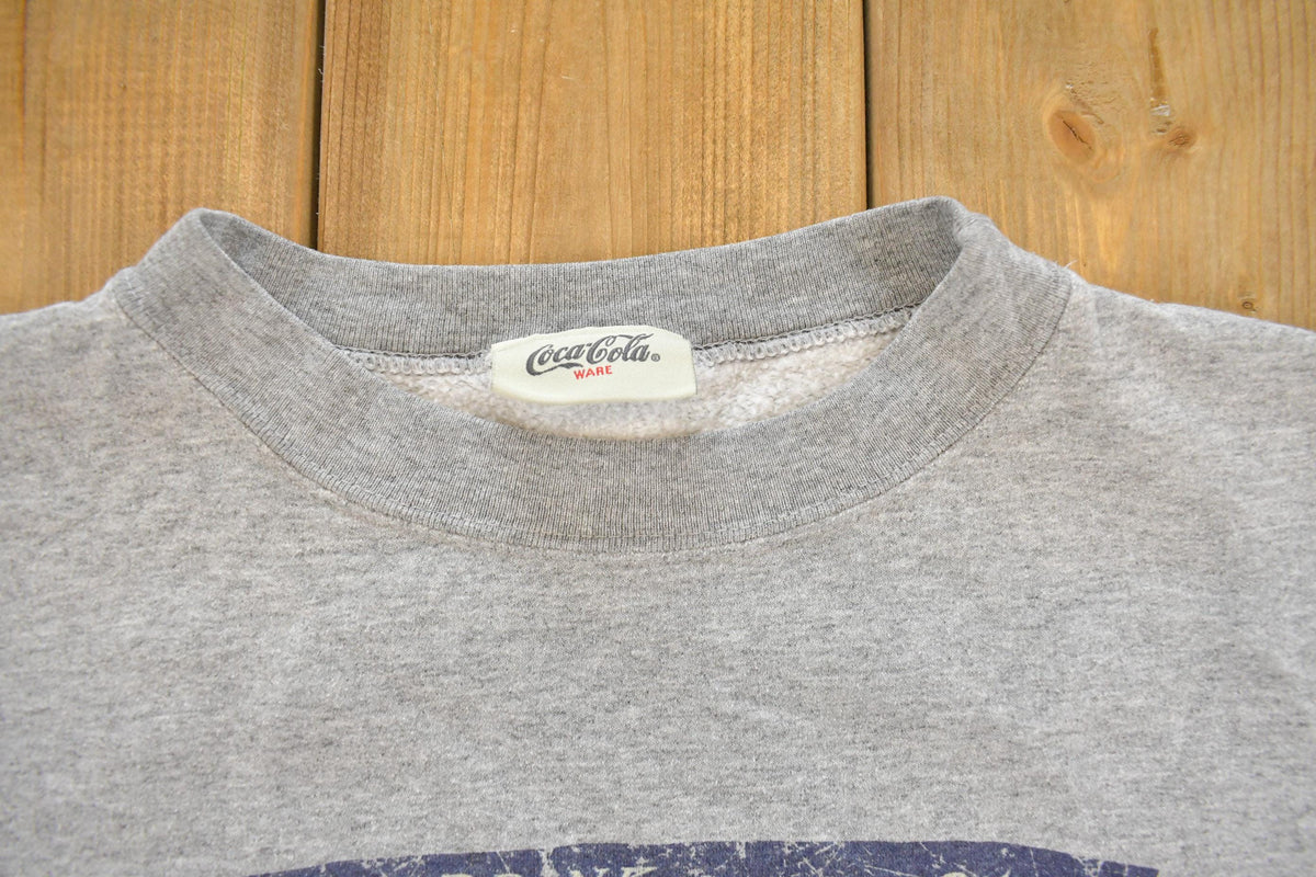Vintage 1990s Coca Cola Art Graphic Crewneck Sweatshirt Men's L from propervintagecanada