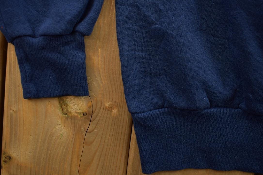 Vintage 1990s College Graphic Collegiate Crewneck Sweatshirt Men's Large from propervintagecanada