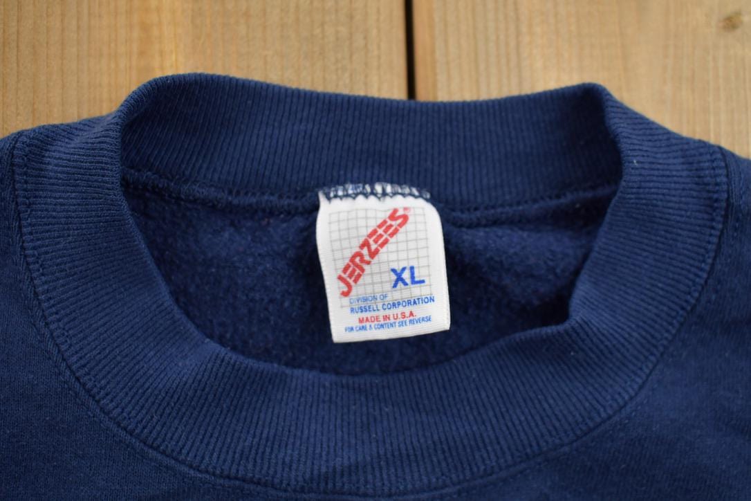 Vintage 1990s College Graphic Collegiate Crewneck Sweatshirt Men's Large from propervintagecanada