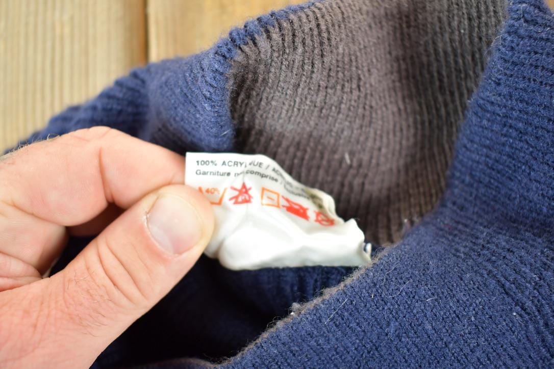 Vintage 1990s Comfort Zone Reindeer Sledding AOP Knit Abstract Pattern Collared Crewneck Sweater Mens L from propervintagecanada