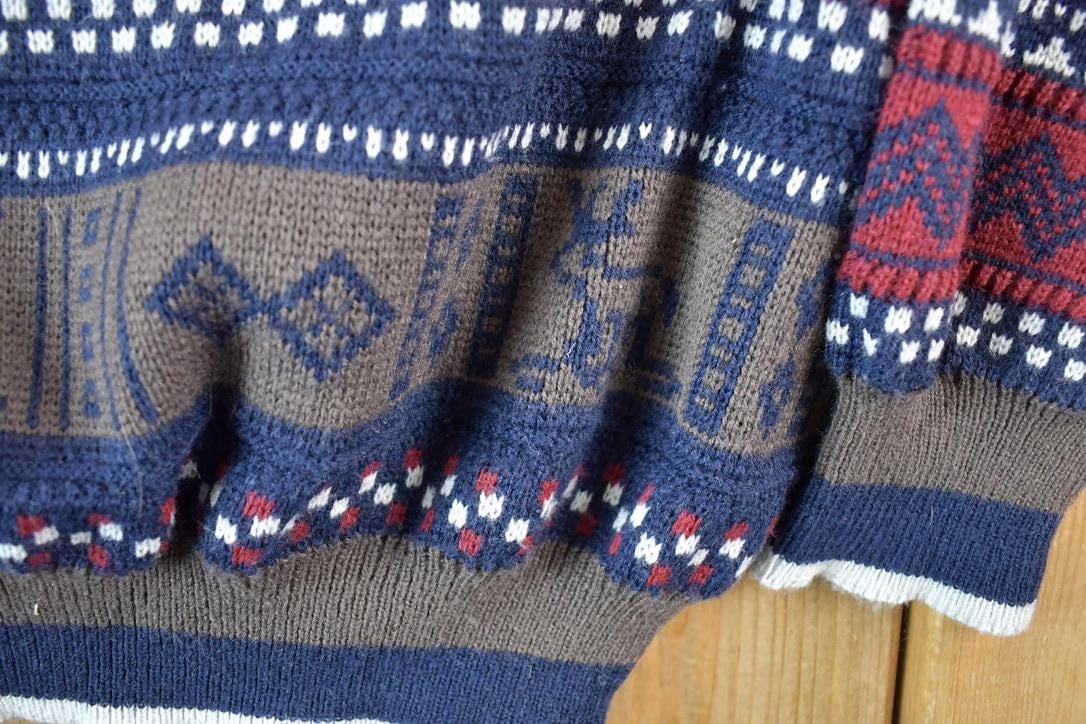 Vintage 1990s Comfort Zone Reindeer Sledding AOP Knit Abstract Pattern Collared Crewneck Sweater Mens L from propervintagecanada