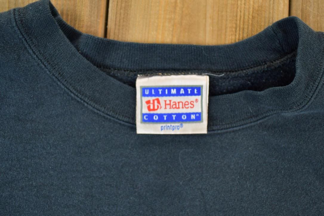 Vintage 1990s Cretin University Raiders Collegiate Crew Neck Men's Medium from propervintagecanada