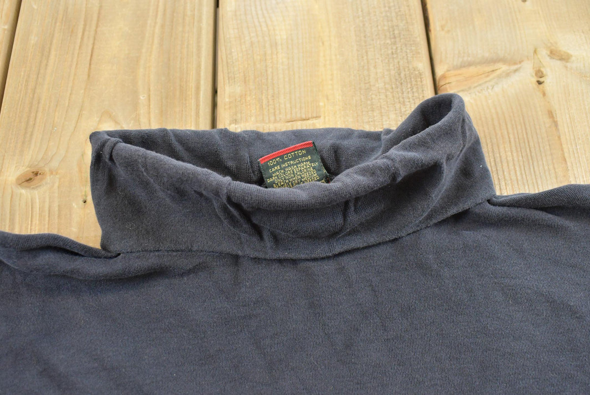 Vintage 1990s Cross Creek Turtleneck Blank Black Long Sleeve T-Shirt Mens M from propervintagecanada
