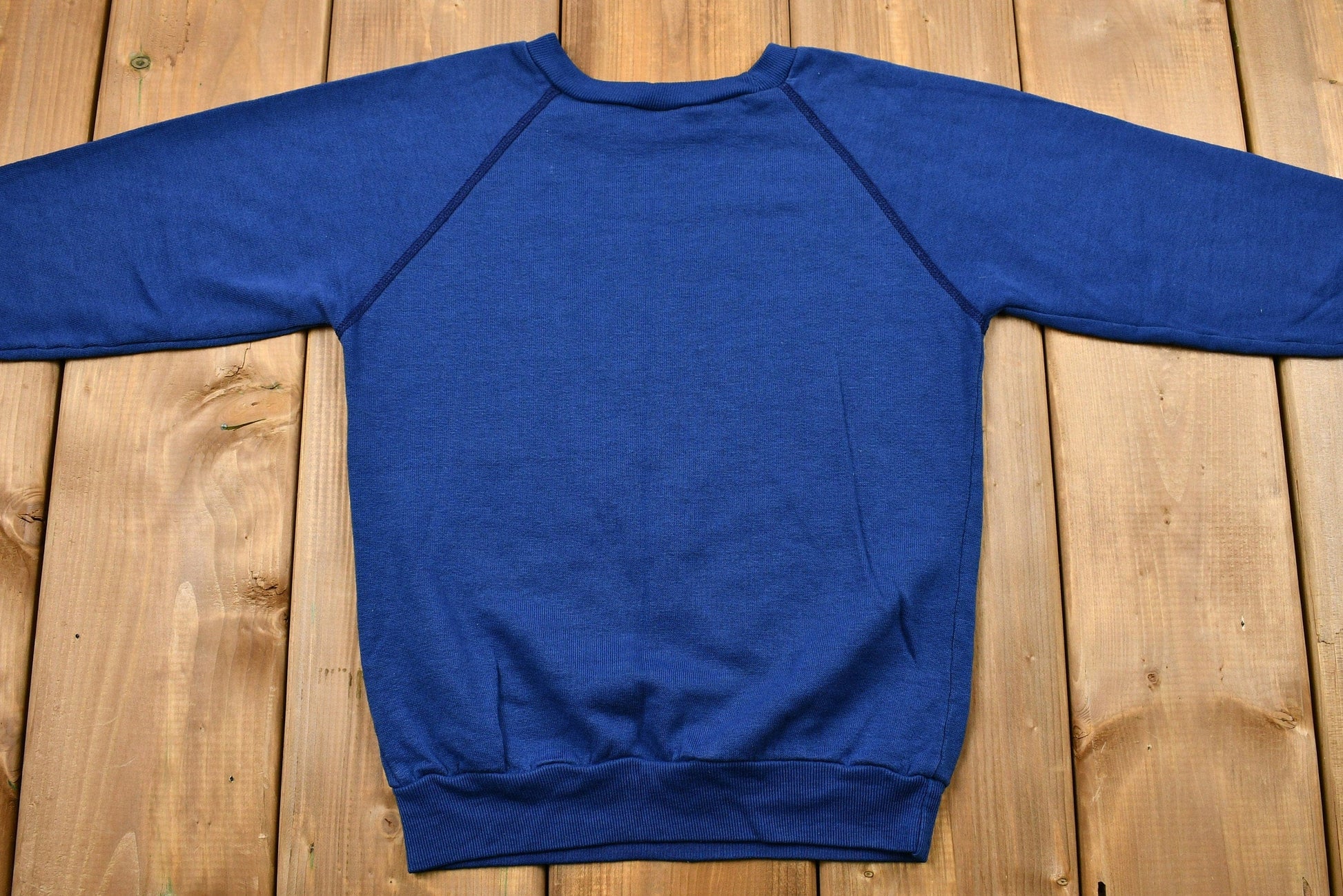 Vintage 1990s Dallas Cowboys Youth Raglan Sweatshirt Youth S from propervintagecanada