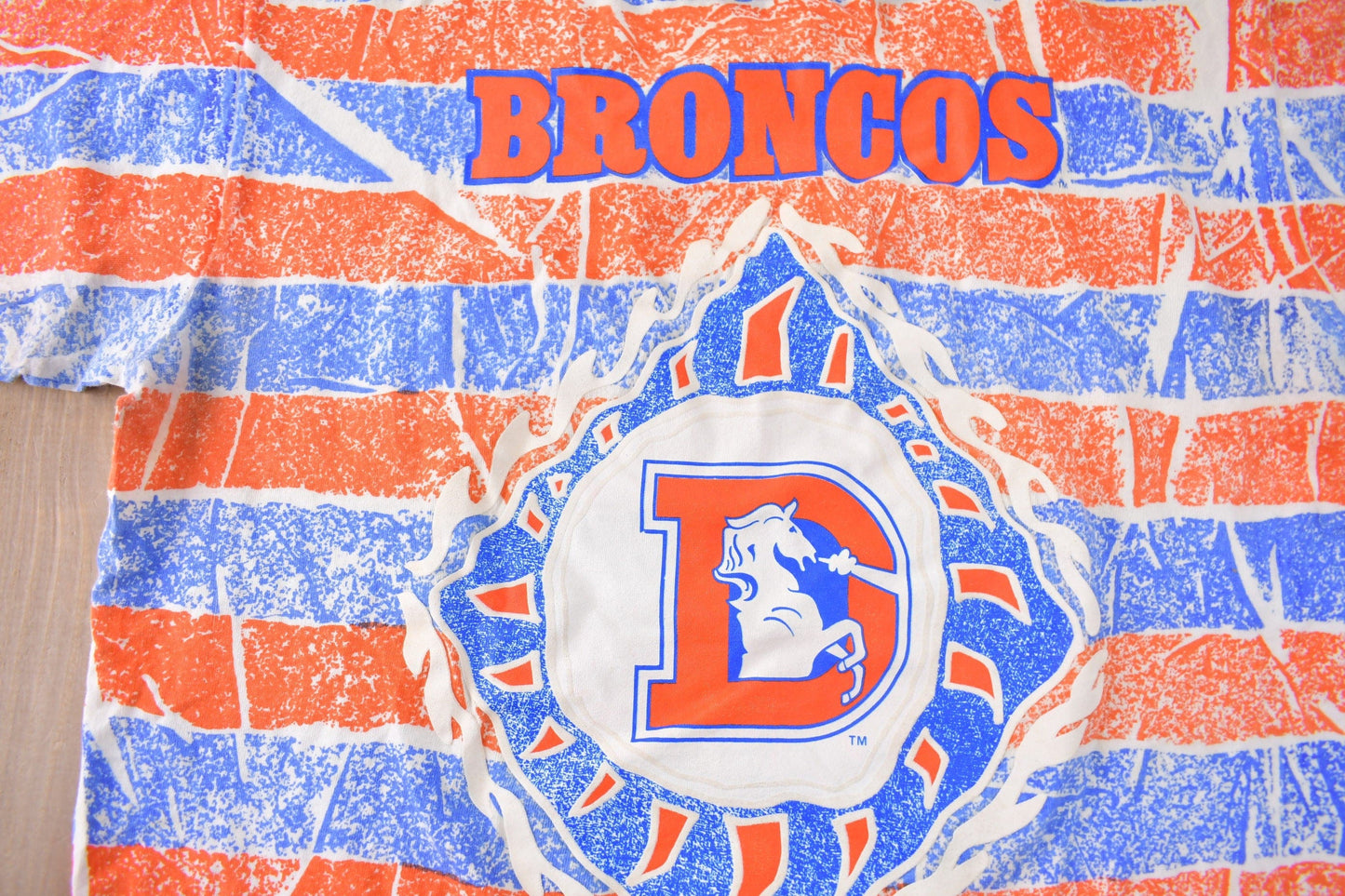 Vintage 1990s Denver Broncos NFL Football All Over Print Graphic T-Shirt Men's Large from propervintagecanada