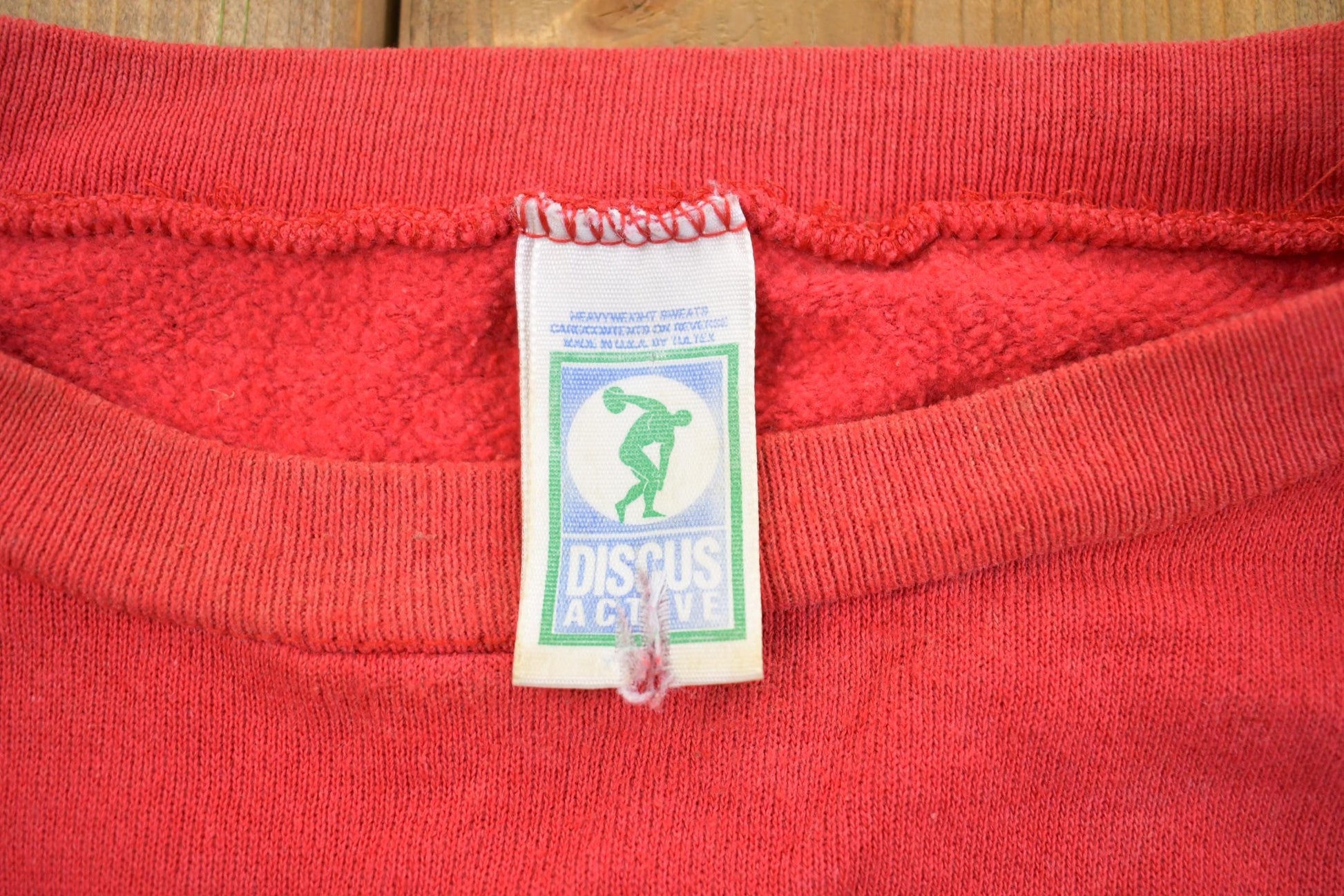 Vintage 1990s Discus Active Boxy Sun-faded Crewneck Sweatshirt Men's XL from propervintagecanada