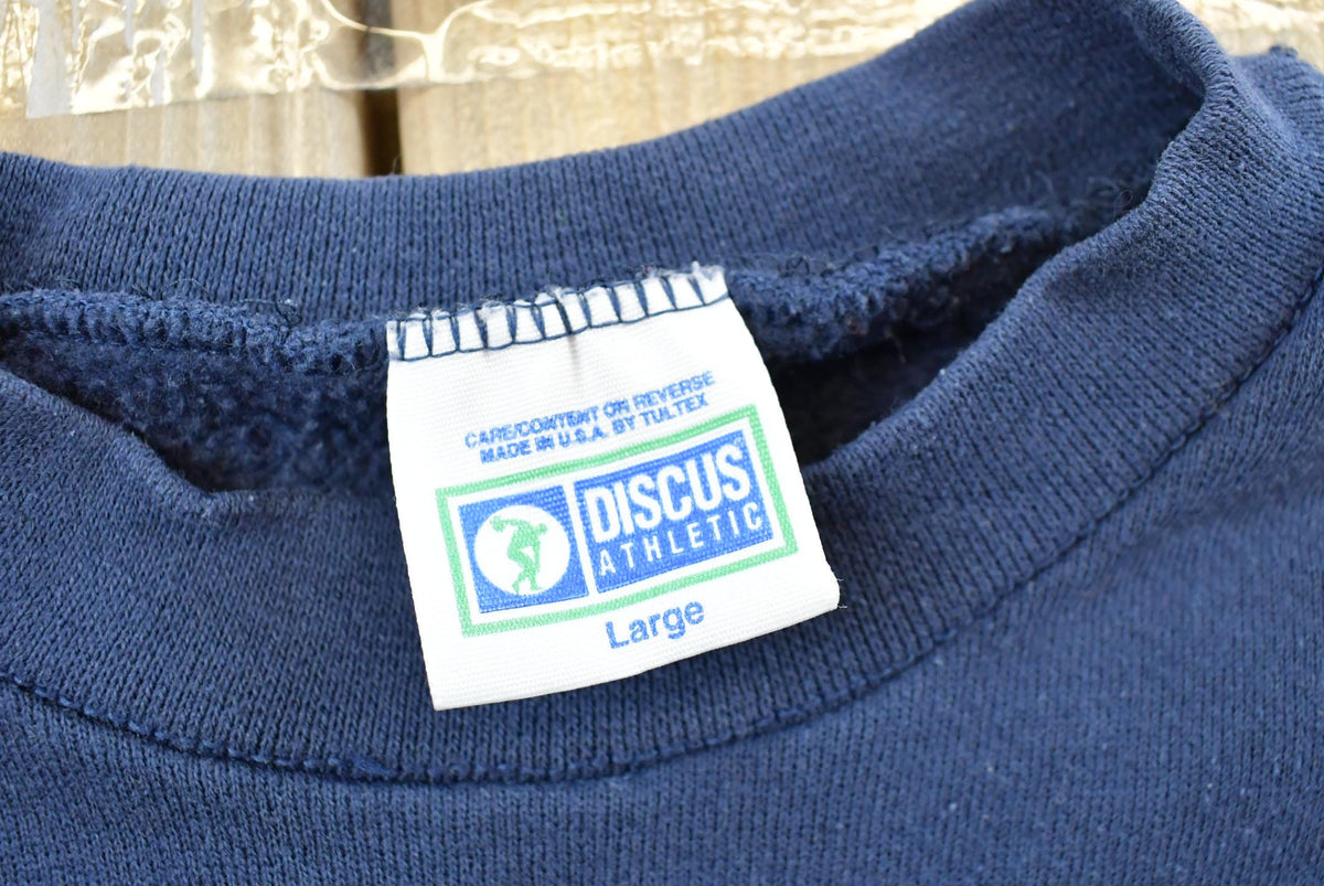 Vintage 1990s Discus Athletics Made In USA Basic Blank Blue Crewneck Sweatshirt Men's M from propervintagecanada