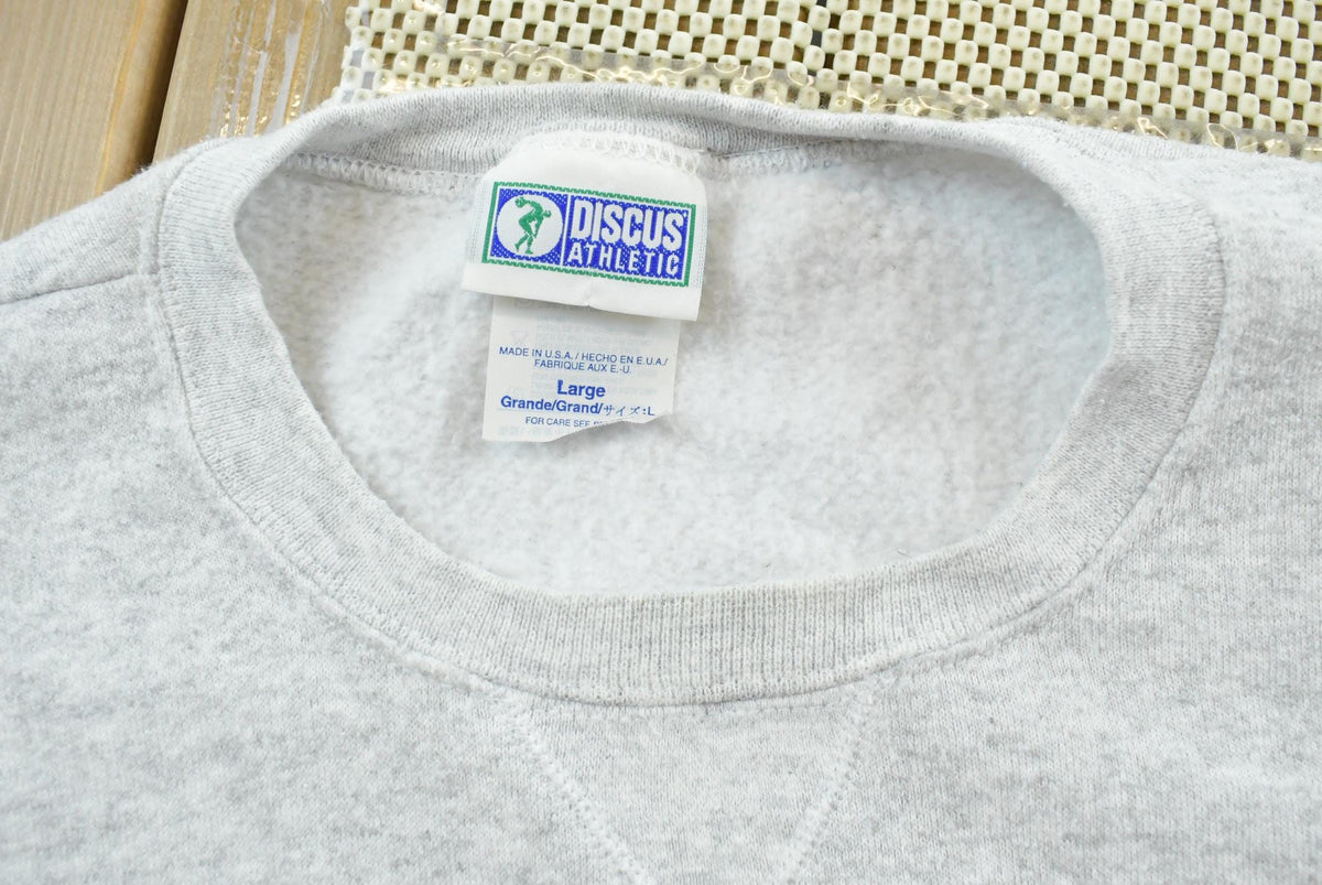 Vintage 1990s Discus Athletics Made In USA Basic Blank Grey Crewneck Sweatshirt Men's L from propervintagecanada