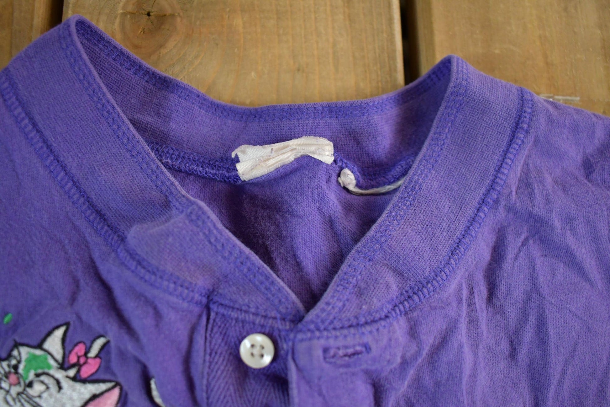 Vintage 1990s Disney Embroidered Aristocats Henley Men's Medium from propervintagecanada