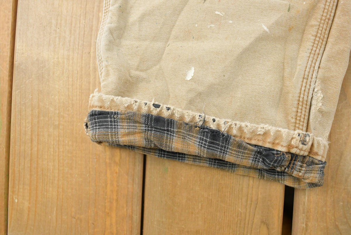 Vintage 1990s Distressed Carhartt Lined Canvas Work Pants Men's 28 x 28 from propervintagecanada